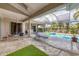 Spacious pool and spa area with patio furniture and screened enclosure at 4211 Palacio Dr, Sarasota, FL 34238