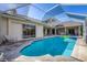 Enjoy this large screened in pool and spa with plenty of space for relaxation at 4211 Palacio Dr, Sarasota, FL 34238