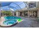 Stunning pool and spa with a screened enclosure, perfect for relaxation at 4211 Palacio Dr, Sarasota, FL 34238