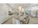 Bright, spacious kitchen featuring white cabinetry, marble countertops, and a large island at 510 Bowsprit Ln, Longboat Key, FL 34228