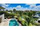 Backyard oasis featuring a pool, hot tub, and views of the canal at 510 Bowsprit Ln, Longboat Key, FL 34228