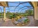 Lush patio with pond and waterfall feature at 521 Luminary Blvd, Osprey, FL 34229