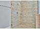 Large walk-in shower with glass enclosure and neutral tile at 5403 Tidewater Preserve Blvd, Bradenton, FL 34208