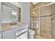 Bathroom with a walk-in shower, toilet, and vanity at 5403 Tidewater Preserve Blvd, Bradenton, FL 34208