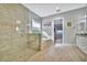 Luxurious bathroom with a large walk-in shower, soaking tub, and separate vanity at 5403 Tidewater Preserve Blvd, Bradenton, FL 34208