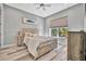 Light and airy bedroom with coastal decor and hardwood floors at 5403 Tidewater Preserve Blvd, Bradenton, FL 34208