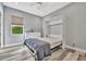 Bedroom with a wall bed, dresser, and light wood flooring at 5403 Tidewater Preserve Blvd, Bradenton, FL 34208