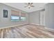 Bedroom with water views and wood-look floors at 5403 Tidewater Preserve Blvd, Bradenton, FL 34208