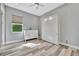 Bedroom with a wall bed, dresser, and light wood flooring at 5403 Tidewater Preserve Blvd, Bradenton, FL 34208