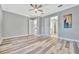 Bedroom with wood-look floors and ceiling fan at 5403 Tidewater Preserve Blvd, Bradenton, FL 34208