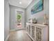 Bright and airy entryway with a white console table and coastal decor at 5403 Tidewater Preserve Blvd, Bradenton, FL 34208