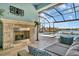 Outdoor fireplace with stone surround located on the lanai at 5403 Tidewater Preserve Blvd, Bradenton, FL 34208