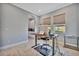 Home office with standing desk and plenty of natural light at 5403 Tidewater Preserve Blvd, Bradenton, FL 34208
