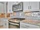 Modern kitchen with stainless steel appliances and backsplash at 5403 Tidewater Preserve Blvd, Bradenton, FL 34208