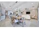 Open-concept living and dining area featuring stylish lighting, providing an inviting space for relaxation and meals at 5403 Tidewater Preserve Blvd, Bradenton, FL 34208