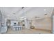 Living room features tile floors, kitchen island, and ceiling fan at 5403 Tidewater Preserve Blvd, Bradenton, FL 34208