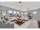 Bright living room with an open layout, complemented by contemporary furnishings and a separate dining area at 5403 Tidewater Preserve Blvd, Bradenton, FL 34208