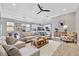 Open-concept living room featuring modern decor and an eat-in kitchen area, perfect for entertaining guests at 5403 Tidewater Preserve Blvd, Bradenton, FL 34208