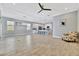 Open concept living room with tile floors and kitchen views at 5403 Tidewater Preserve Blvd, Bradenton, FL 34208