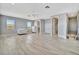 Spacious main bedroom with light wood floors, large windows, and ensuite bathroom at 5403 Tidewater Preserve Blvd, Bradenton, FL 34208