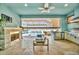 Outdoor kitchen with fireplace and amazing water views at 5403 Tidewater Preserve Blvd, Bradenton, FL 34208
