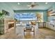 Relaxing outdoor kitchen with a view of the pool and canal at 5403 Tidewater Preserve Blvd, Bradenton, FL 34208