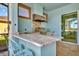 Granite countertop outdoor kitchen with stainless steel grill at 5403 Tidewater Preserve Blvd, Bradenton, FL 34208