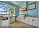 Outdoor kitchen with stainless steel appliances and granite countertops at 5403 Tidewater Preserve Blvd, Bradenton, FL 34208