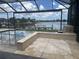 Expansive pool patio offers serene waterfront views, creating a perfect setting for relaxation and entertainment at 5403 Tidewater Preserve Blvd, Bradenton, FL 34208