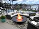 Inviting patio features comfortable seating around a modern fire pit, perfect for outdoor relaxation and entertaining at 5403 Tidewater Preserve Blvd, Bradenton, FL 34208