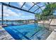 Enjoy this amazing screened pool with water features and canal views at 5403 Tidewater Preserve Blvd, Bradenton, FL 34208