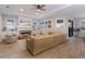 Living area featuring a fireplace, large windows and sectional sofa at 5727 Magnolia Ridge Pl, Sarasota, FL 34243