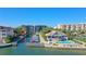 Aerial view of waterfront community with boat slips and pool at 5911 Midnight Pass Rd # 504, Sarasota, FL 34242