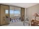 Private balcony with water views and striped rug at 5911 Midnight Pass Rd # 504, Sarasota, FL 34242