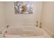 Relaxing bathtub with marble surround at 5911 Midnight Pass Rd # 504, Sarasota, FL 34242