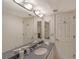 Double vanity bathroom with granite countertop at 5911 Midnight Pass Rd # 504, Sarasota, FL 34242