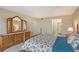 Bedroom with dresser and bedding in coastal colors at 5911 Midnight Pass Rd # 504, Sarasota, FL 34242