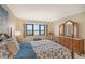Main bedroom with water views and a dresser at 5911 Midnight Pass Rd # 504, Sarasota, FL 34242