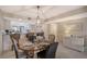 Bright dining area with a table set for four and kitchen bar at 5911 Midnight Pass Rd # 504, Sarasota, FL 34242
