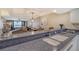 Kitchen with breakfast bar and view into living room at 5911 Midnight Pass Rd # 504, Sarasota, FL 34242