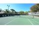 Community tennis court with seating and fencing at 5911 Midnight Pass Rd # 504, Sarasota, FL 34242