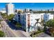 Aerial view of modern building in urban setting with city skyline in background at 635 S Orange Ave # 201, Sarasota, FL 34236