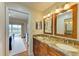 Double vanity bathroom with granite countertops at 6620 Pineview Ter, Bradenton, FL 34203