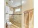 Updated bathroom with glass shower door and neutral tile at 6620 Pineview Ter, Bradenton, FL 34203