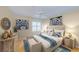 Spacious bedroom with a king-size bed and blue accents at 6620 Pineview Ter, Bradenton, FL 34203