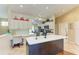 Bright kitchen features an island, white cabinets, and built-in workspace at 6620 Pineview Ter, Bradenton, FL 34203
