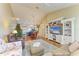 Living room with hardwood floors, fireplace, and built-in shelving at 6620 Pineview Ter, Bradenton, FL 34203