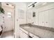 Bathroom with granite countertop, single sink vanity, and shower/tub combo at 665 Park Cir # 58, Bradenton, FL 34207