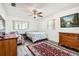 Bright bedroom with ceiling fan, hardwood floors, and ample closet space at 665 Park Cir # 58, Bradenton, FL 34207