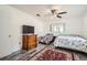 Bedroom with ceiling fan, hardwood floors, and a view of the backyard at 665 Park Cir # 58, Bradenton, FL 34207